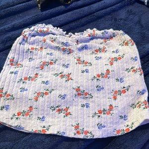 A white flower tub top. Its from urban outfitters. Its very stretchy.